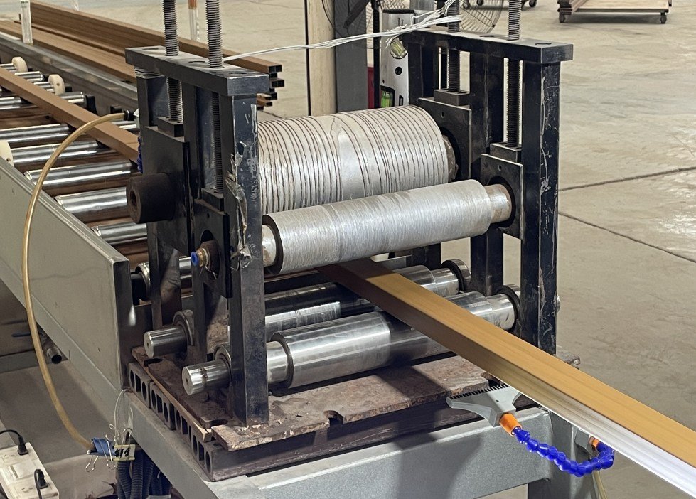 Precision engineering creates realistic 3D wood textures on aluminum